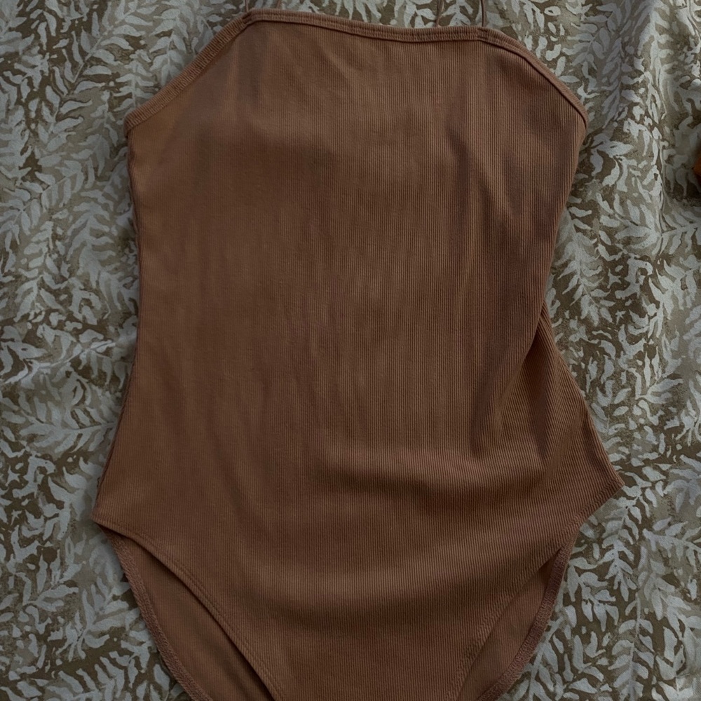 tan body suit